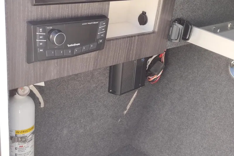 Slide: The Image of 2026 Formula 310 Bowrider interior with white leather seating and speaker detail. - 58