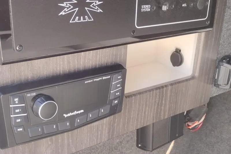 Slide: The Image of Interior of 2026 Formula 310 Bowrider boat with white seating and speaker. - 59