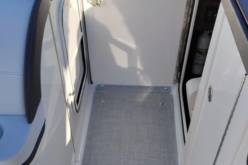 Slide: The Image of Luxurious seating on 2026 Formula 310 Bowrider boat, featuring sleek white upholstery. - 60