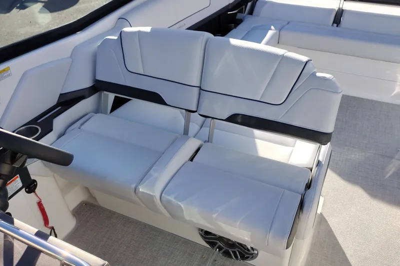 Slide: The Image of 2026 Formula 310 Bowrider interior with white seating and speaker detail. - 64