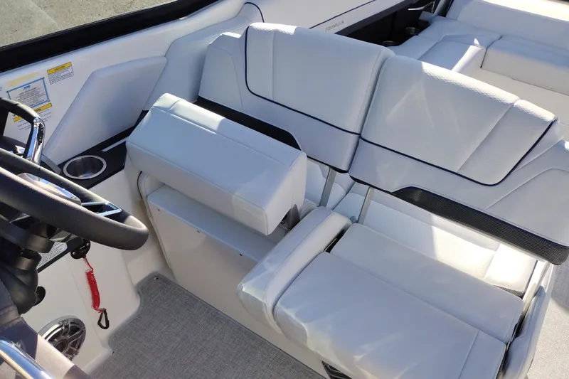 Slide: The Image of 2026 Formula 310 Bowrider interior seating with white upholstery and sleek design. - 65