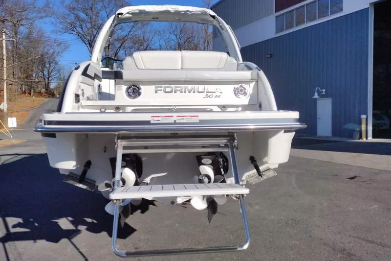 Slide: The Image of 2026 Formula 310 Bowrider dual propellers on snowy ground, featuring MerCruiser engines. - 7