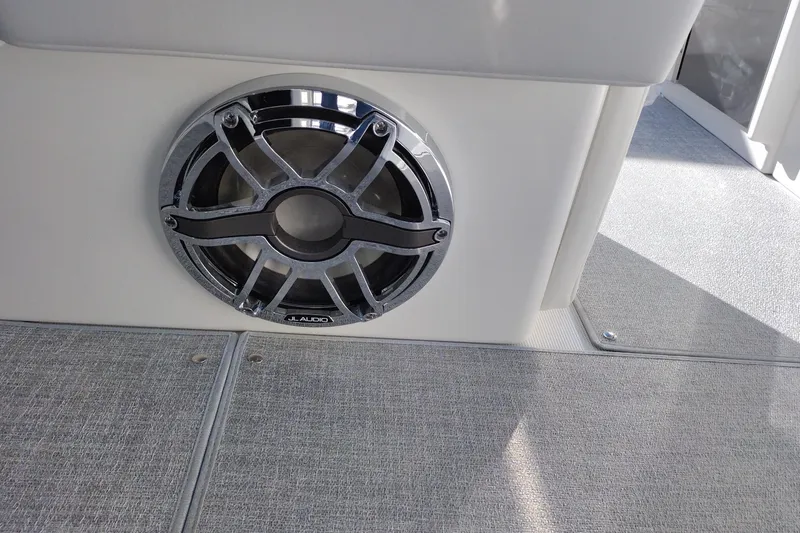 Slide: The Image of Storage compartment in 2026 Formula 310 Bowrider boat with white cushions. - 73
