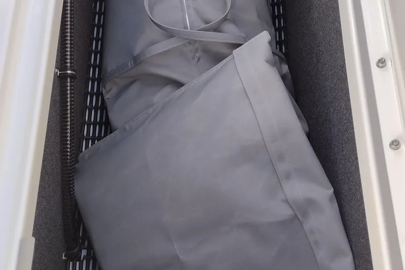 Slide: The Image of Open storage compartment on 2026 Formula 310 Bowrider boat deck. - 74