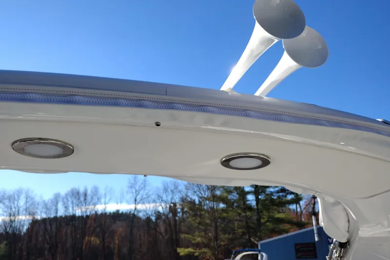 Slide: The Image of 2026 Formula 310 Bowrider interior with white seating and cup holders. - 80