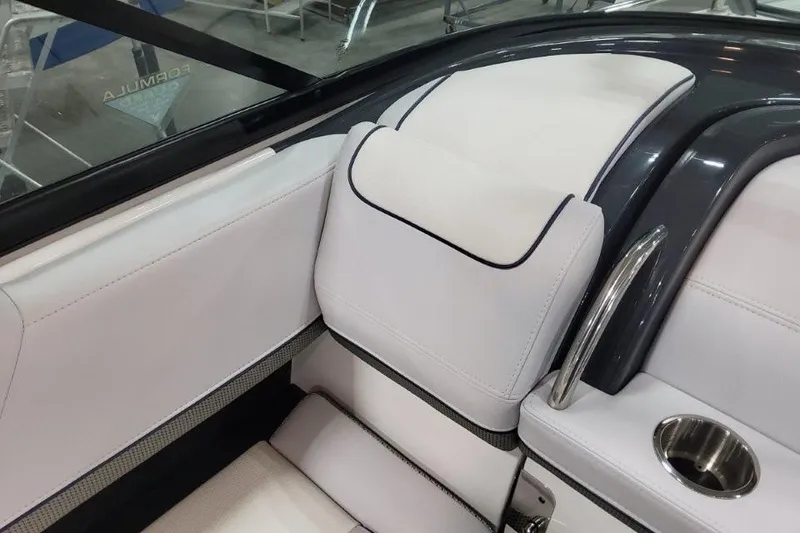 Slide: The Image of 2026 Formula 310 Bowrider interior with white seating and stainless steel accents. - 85