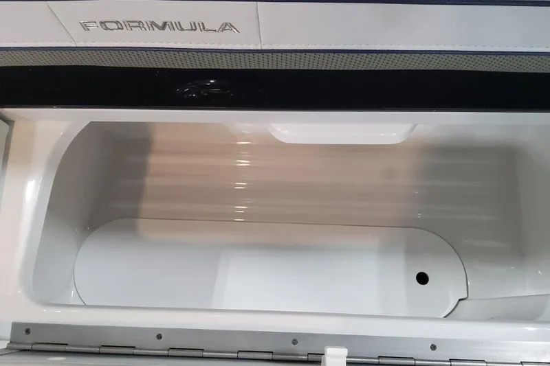 Slide: The Image of Open storage compartment in 2026 Formula 310 Bowrider boat. - 88