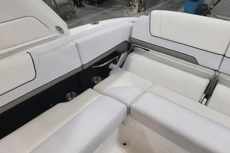 Slide: The Image of 2026 Formula 310 Bowrider interior with white seating and cup holders. - 97