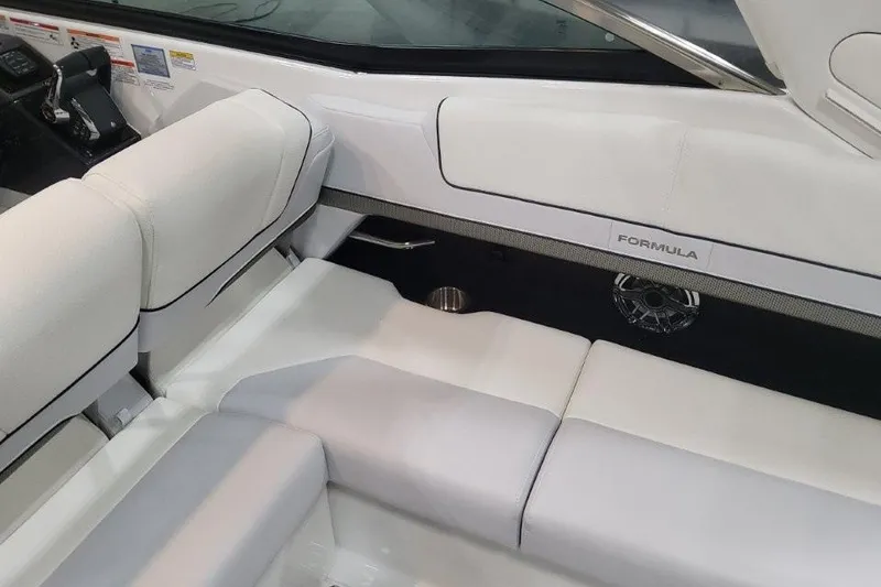 Slide: The Image of Interior of 2026 Formula 310 Bowrider with white seating and sleek design. - 99