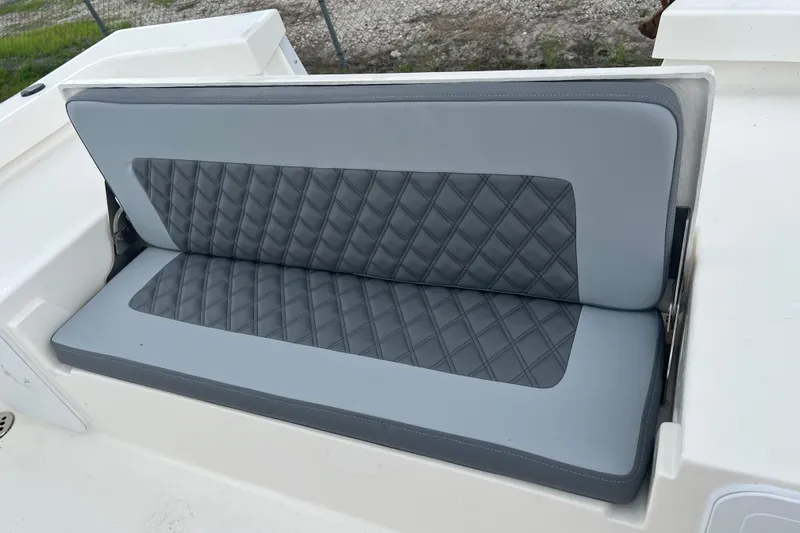 Slide: The Image of Gray cushioned seat on 2026 Defiance CATALINA 190 boat, featuring diamond stitching. - 12