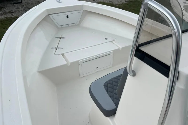 Slide: The Image of 2026 Defiance CATALINA 190 boat interior with seating and storage compartments. - 13