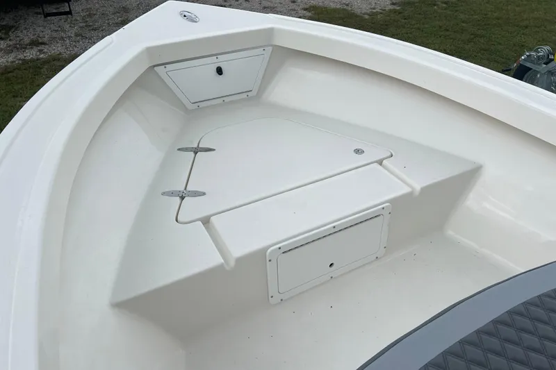 Slide: The Image of 2026 Defiance CATALINA 190 boat bow with storage compartments and clean white finish. - 14