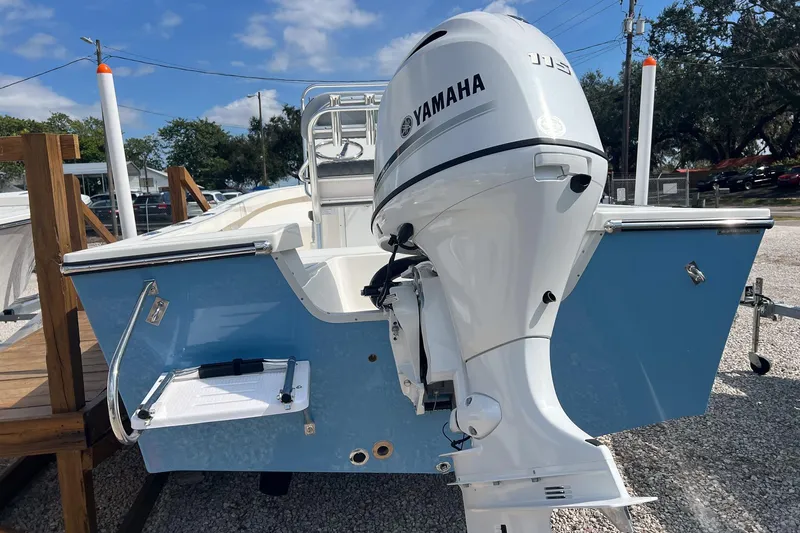 Slide: The Image of 2026 Defiance Catalina 190 boat with Yamaha outboard motor, displayed outdoors. - 18