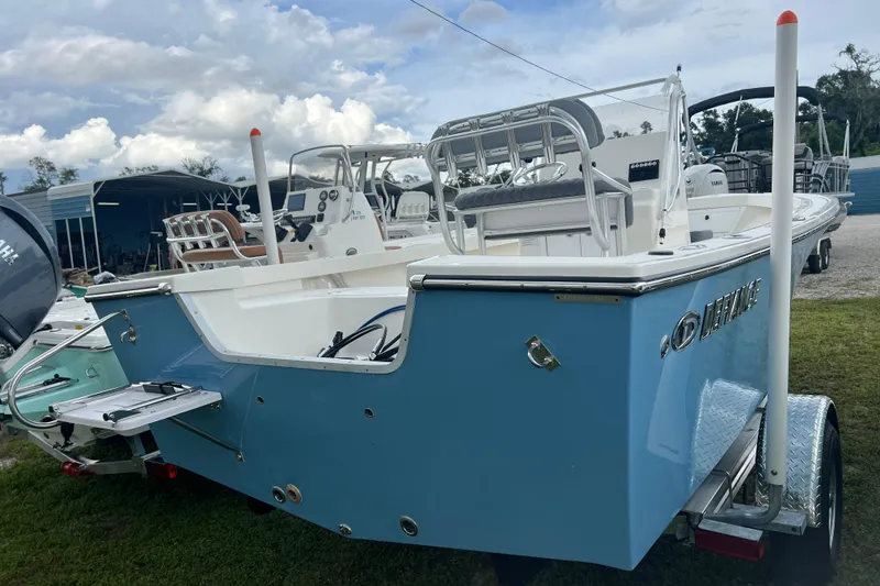 Slide: The Image of 2026 Defiance CATALINA 190 boat on trailer, blue hull, outdoor display. - 3
