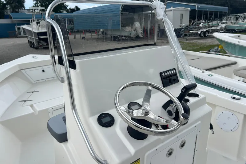 Slide: The Image of 2026 Defiance CATALINA 190 boat console with steering wheel and controls. - 6