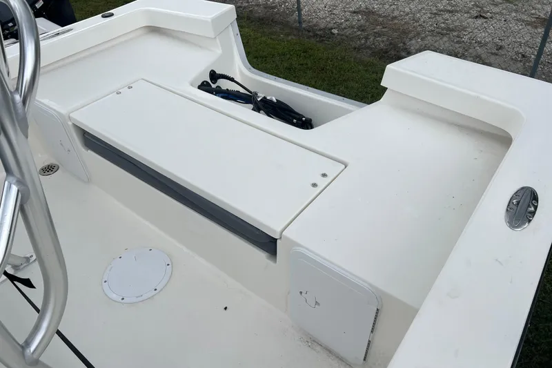 Slide: The Image of 2026 Defiance CATALINA 190 boat deck with storage compartments and railing. - 9