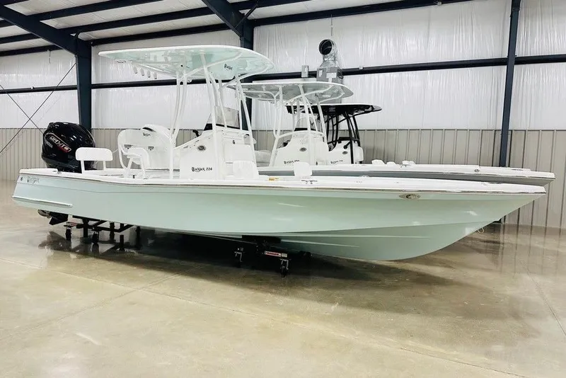 The Image of 2026 BlackJack 224 boat in a showroom, featuring sleek design and modern features. - 1