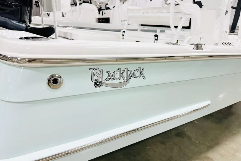 Slide: The Image of 2026 BlackJack 224 boat side view with logo and sleek design. - 12