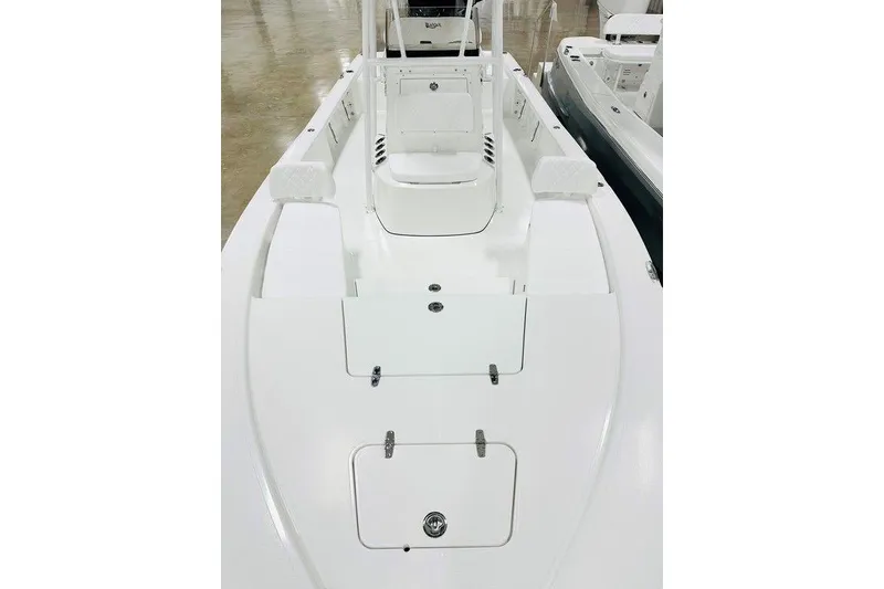 Slide: The Image of 2026 BlackJack 224 boat interior with white seating and storage compartments. - 13