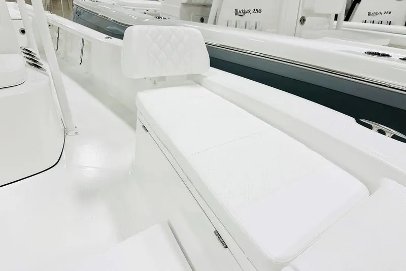 Slide: The Image of 2026 BlackJack 224 boat interior with white cushioned seating and sleek design. - 5