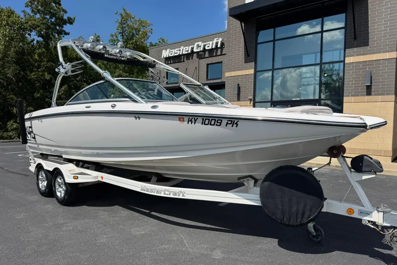 Slide: The Image of 2006 MasterCraft X-45 boat on trailer, parked outside dealership. - 1