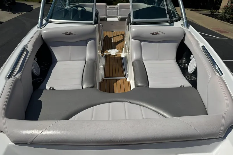 Slide: The Image of 2006 MasterCraft X-45 boat interior with gray seating and wood flooring. - 19