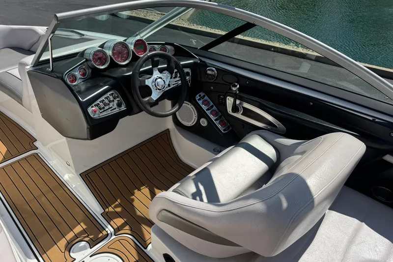 Slide: The Image of 2006 MasterCraft X-45 boat interior with sleek dashboard and comfortable seating. - 8