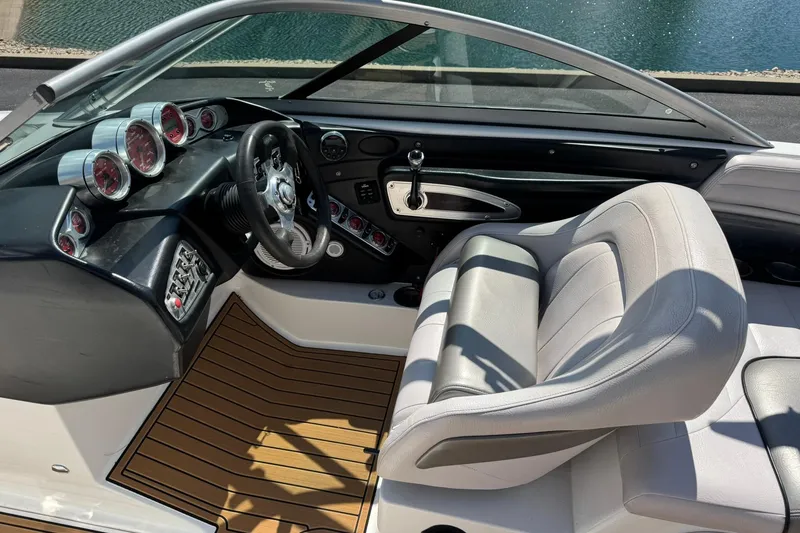 Slide: The Image of 2006 MasterCraft X-45 boat interior with sleek dashboard and comfortable seating. - 9