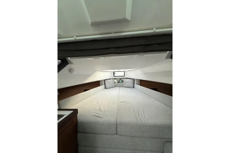 Slide: The Image of 2020 Axopar 37 Sun-Top interior with modern steering and comfortable seating. - 12