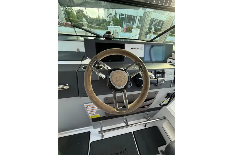 Slide: The Image of 2020 Axopar 37 Sun-Top boat kitchenette with sink and cleaning supplies. - 27