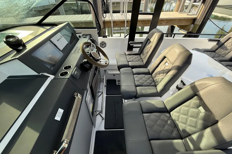Slide: The Image of 2020 Axopar 37 Sun-Top boat interior with seating and storage compartments. - 35