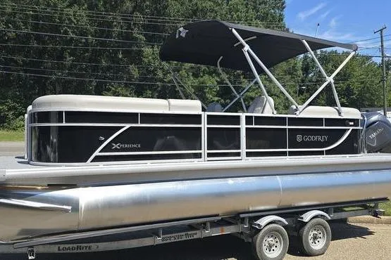The Image of 2026 Godfrey Xperience 2286 SBX Sport Tube pontoon boat on trailer, side view. - 0