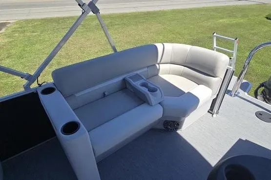 Slide: The Image of 2026 Godfrey Xperience 2286 SBX Sport Tube boat seating area with cup holders and ladder. - 13