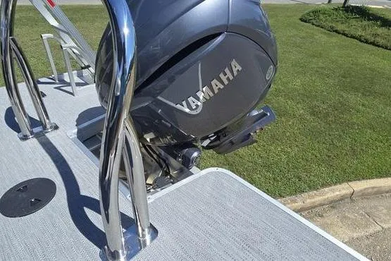 Slide: The Image of 2026 Godfrey Xperience 2286 SBX with Yamaha outboard motor on a sunny day. - 2