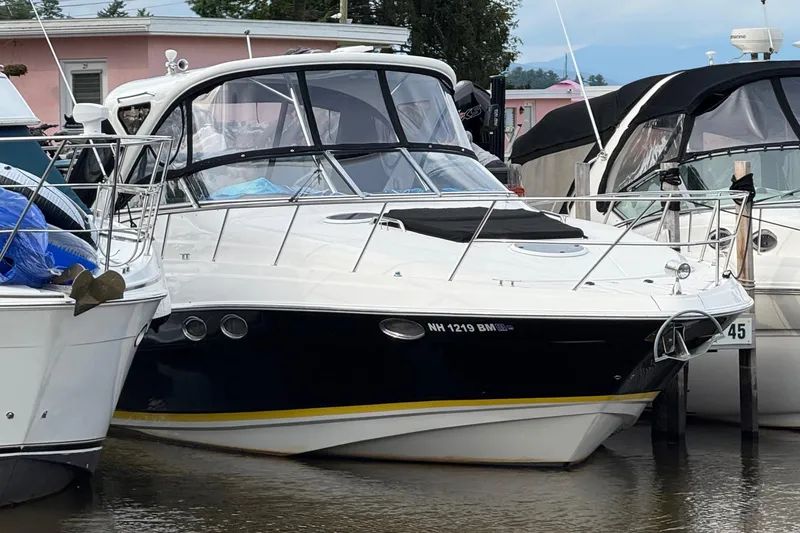 The Image of 2007 Regal Commodore 3760 IO boat docked at marina, surrounded by other vessels. - 0