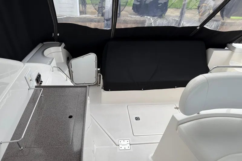 Slide: The Image of 2007 Regal Commodore 3760 IO boat interior with seating and kitchenette area. - 4