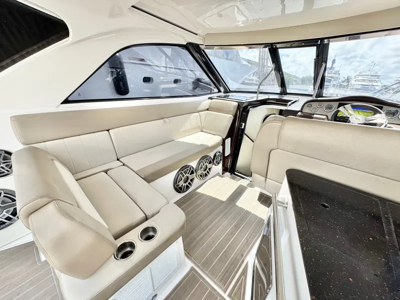 Slide: The Image of Interior of 2015 Regal 35 Sport Coupe with beige seating and modern dashboard. - 17