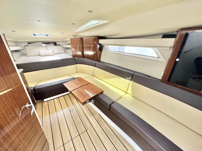 Slide: The Image of Luxurious interior of 2015 Regal 35 Sport Coupe with elegant seating and wooden accents. - 20