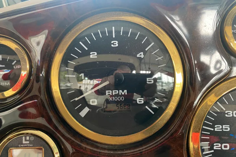 Slide: The Image of Close-up of 2002 Rinker 342 Fiesta Vee RPM gauge showing 568 hours. - 15