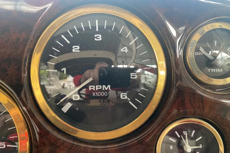 Slide: The Image of Close-up of 2002 Rinker 342 Fiesta Vee boat dashboard with RPM gauge. - 16