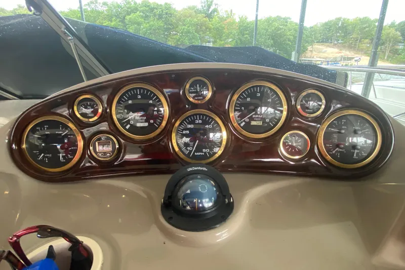 Slide: The Image of Dashboard of 2002 Rinker 342 Fiesta Vee boat with gauges and controls. - 17