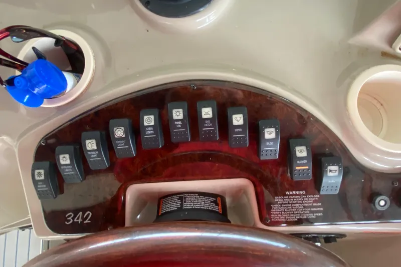 Slide: The Image of Control panel of 2002 Rinker 342 Fiesta Vee boat with labeled switches. - 19