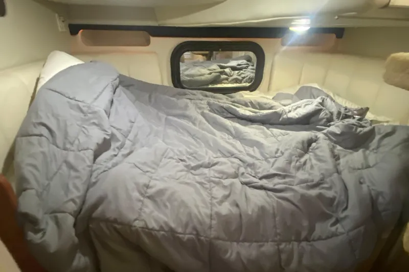 Slide: The Image of Cozy cabin interior of 2002 Rinker 342 Fiesta Vee with a comfortable bed. - 31