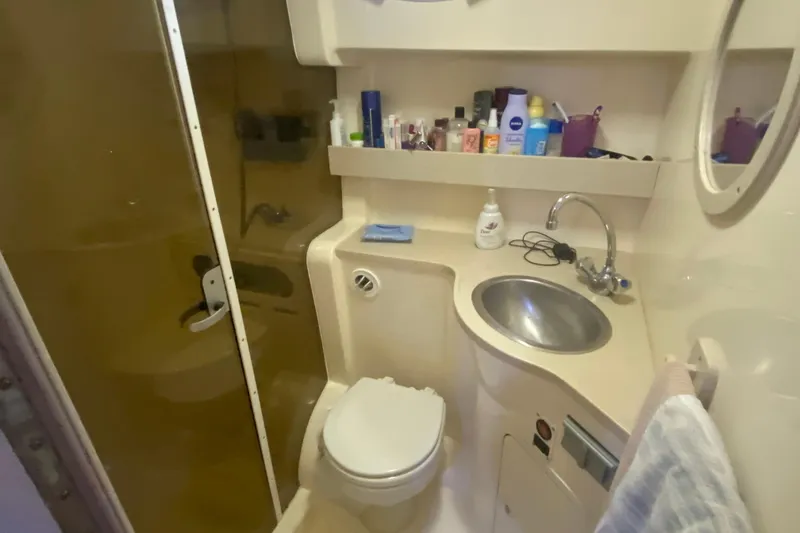 Slide: The Image of Bathroom interior of 2002 Rinker 342 Fiesta Vee boat with sink and shower. - 32