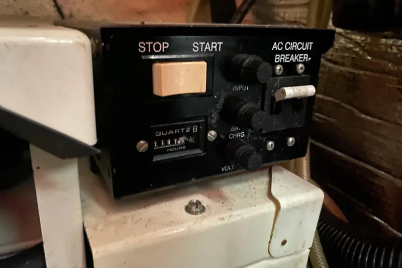 Slide: The Image of Control panel of a 2002 Rinker 342 Fiesta Vee boat with hour meter and circuit breaker. - 36