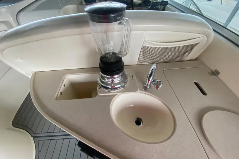Slide: The Image of 2002 Rinker 342 Fiesta Vee boat interior with sink and blender on countertop. - 8