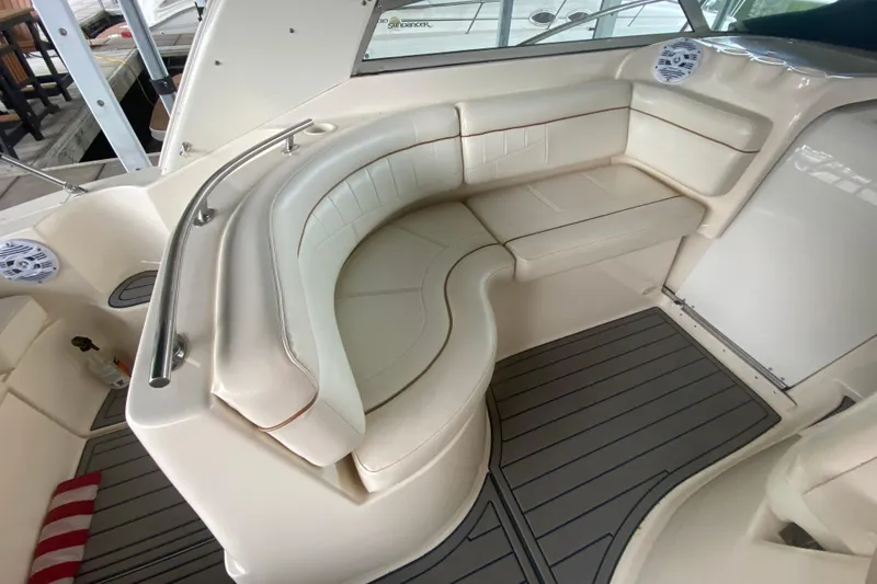 Slide: The Image of 2002 Rinker 342 Fiesta Vee boat interior with curved seating and modern design. - 9
