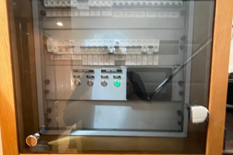 Slide: The Image of Electrical control panel in a Serenity 64 model, 2018, with switches and indicators. - 36