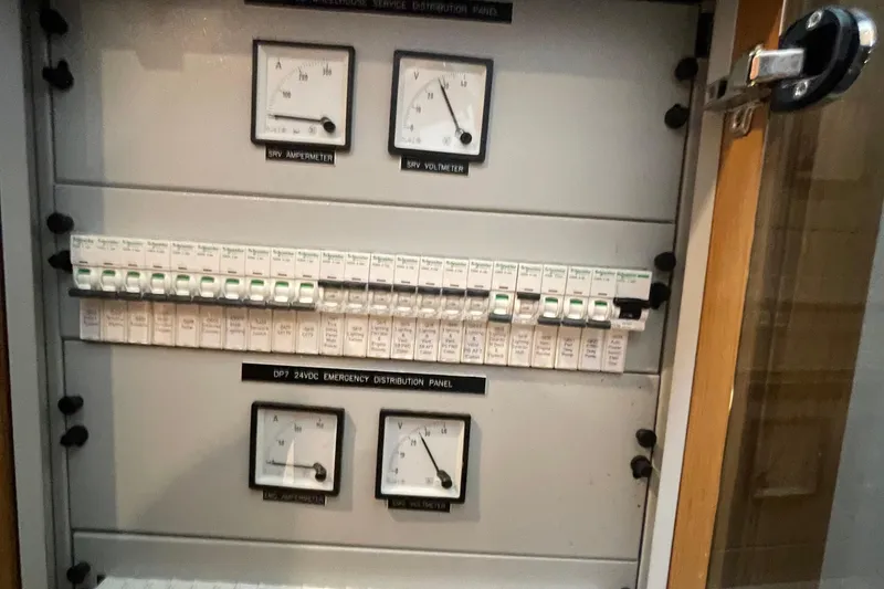 Slide: The Image of Electrical distribution panel with gauges and circuit breakers, Serenity 64, 2018 model. - 39