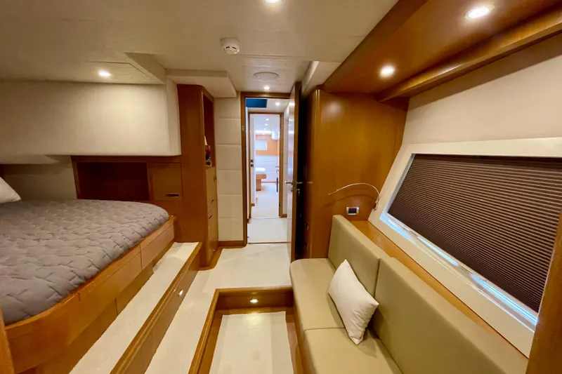 Slide: The Image of Luxurious interior of 2018 Serenity 64 yacht with cozy bedroom and seating area. - 60